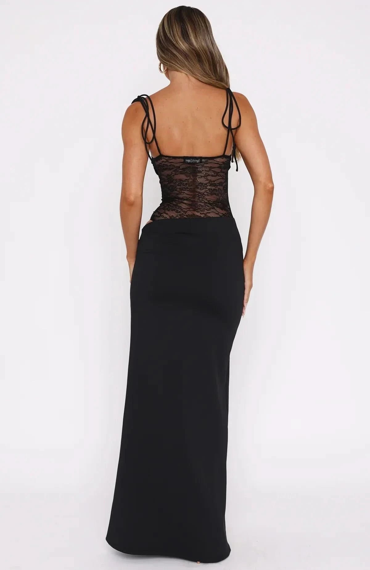 Back view of black maxi dress showing lace panel and tie shoulder straps
