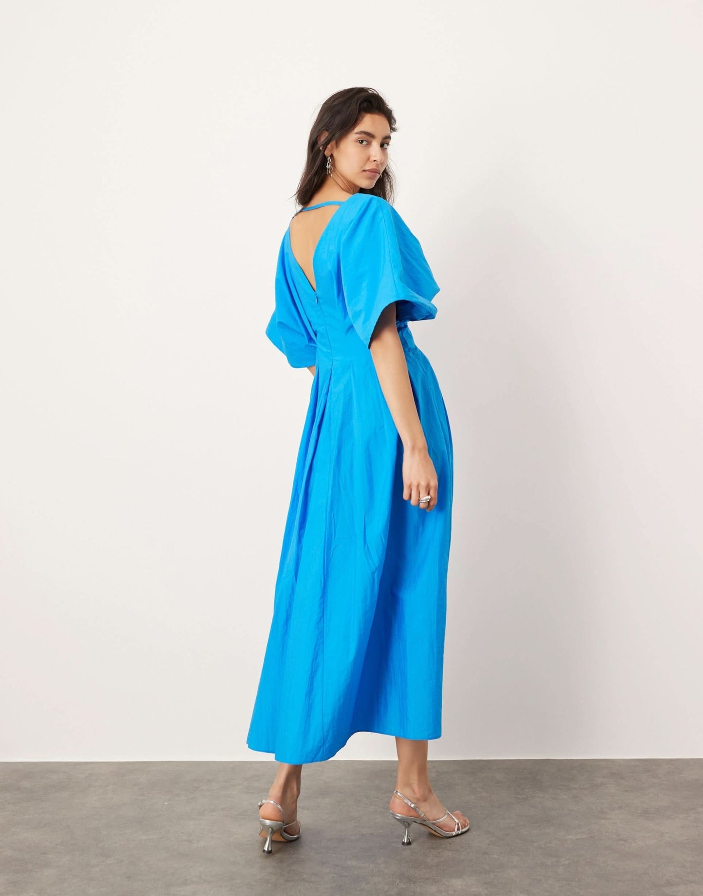 Blue V-neck wrap midi dress back view showing open back design for women