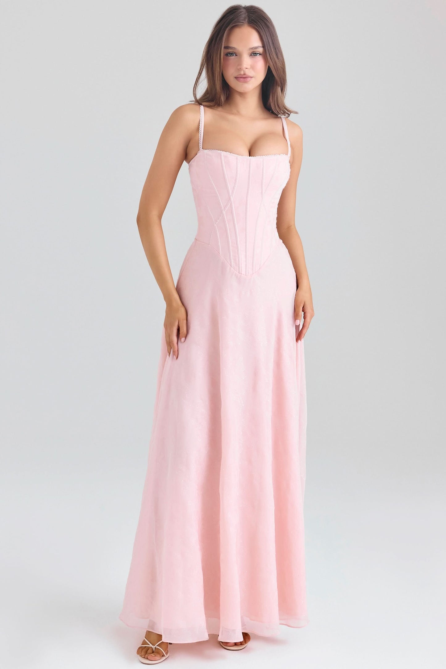 Pink chiffon maxi dress with corset-style bodice and flowing skirt