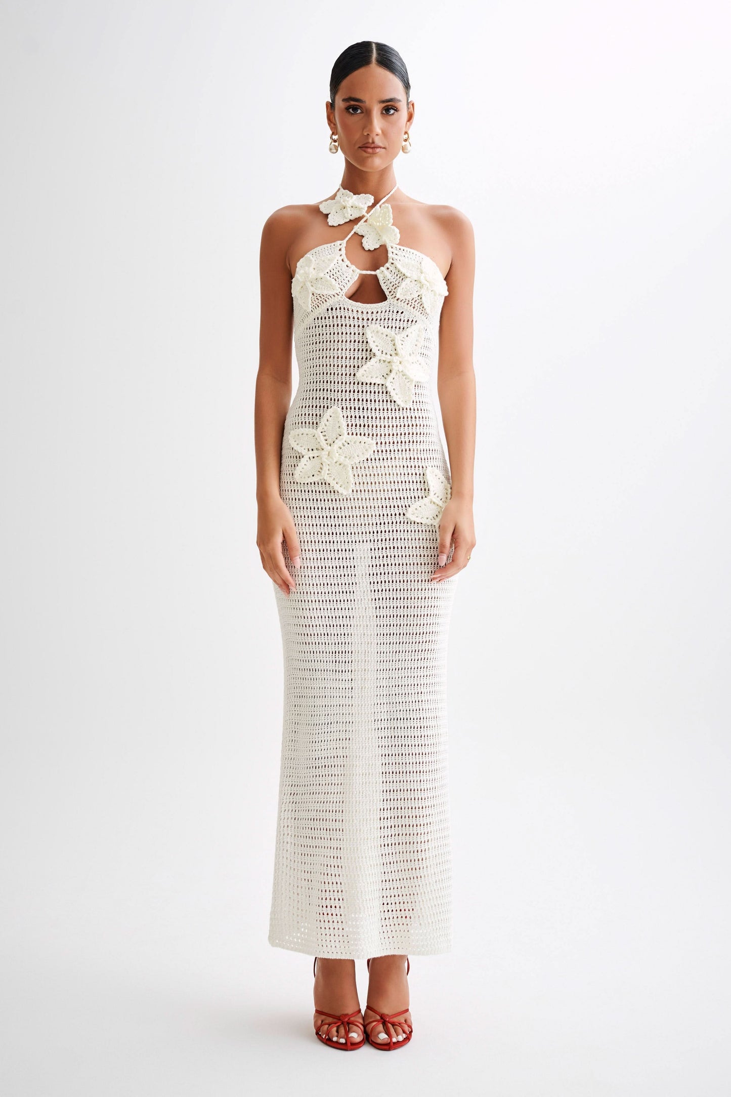 Cream crochet maxi dress with halter neck and delicate floral crochet details down the front