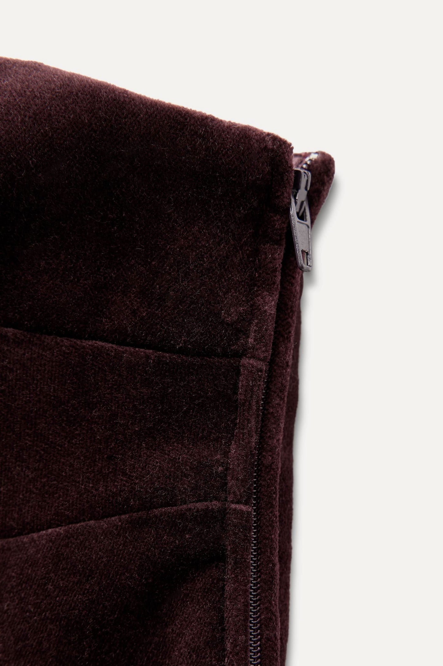 Burgundy velvet dress side seam and zipper detail