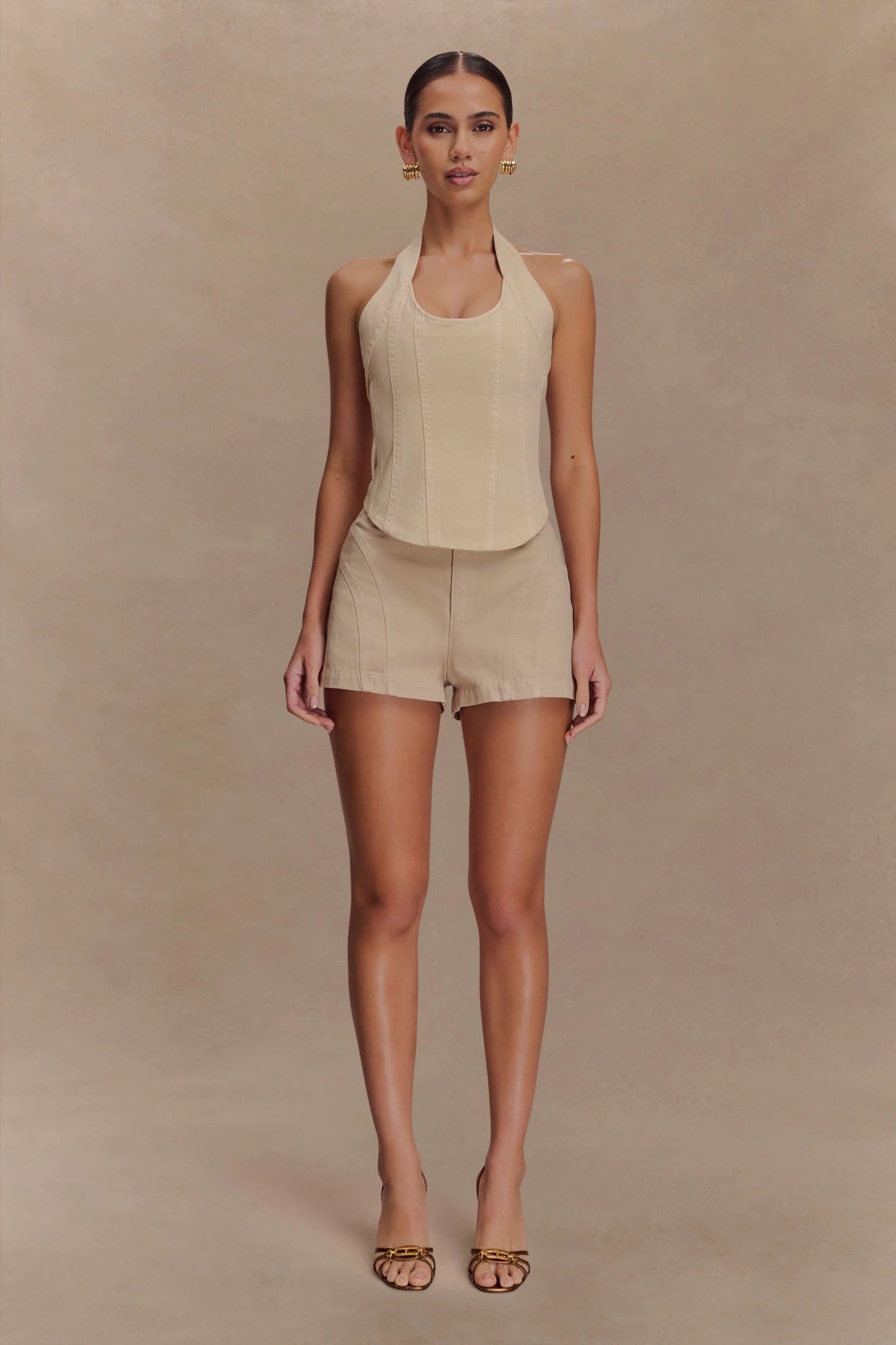 Beige sleeveless halter crop top with tailored shorts set