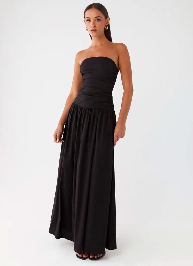 Black strapless maxi dress with ruched bodice and full A-line skirt, front view