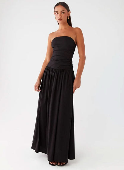 Black strapless maxi dress with ruched bodice and full A-line skirt, front view