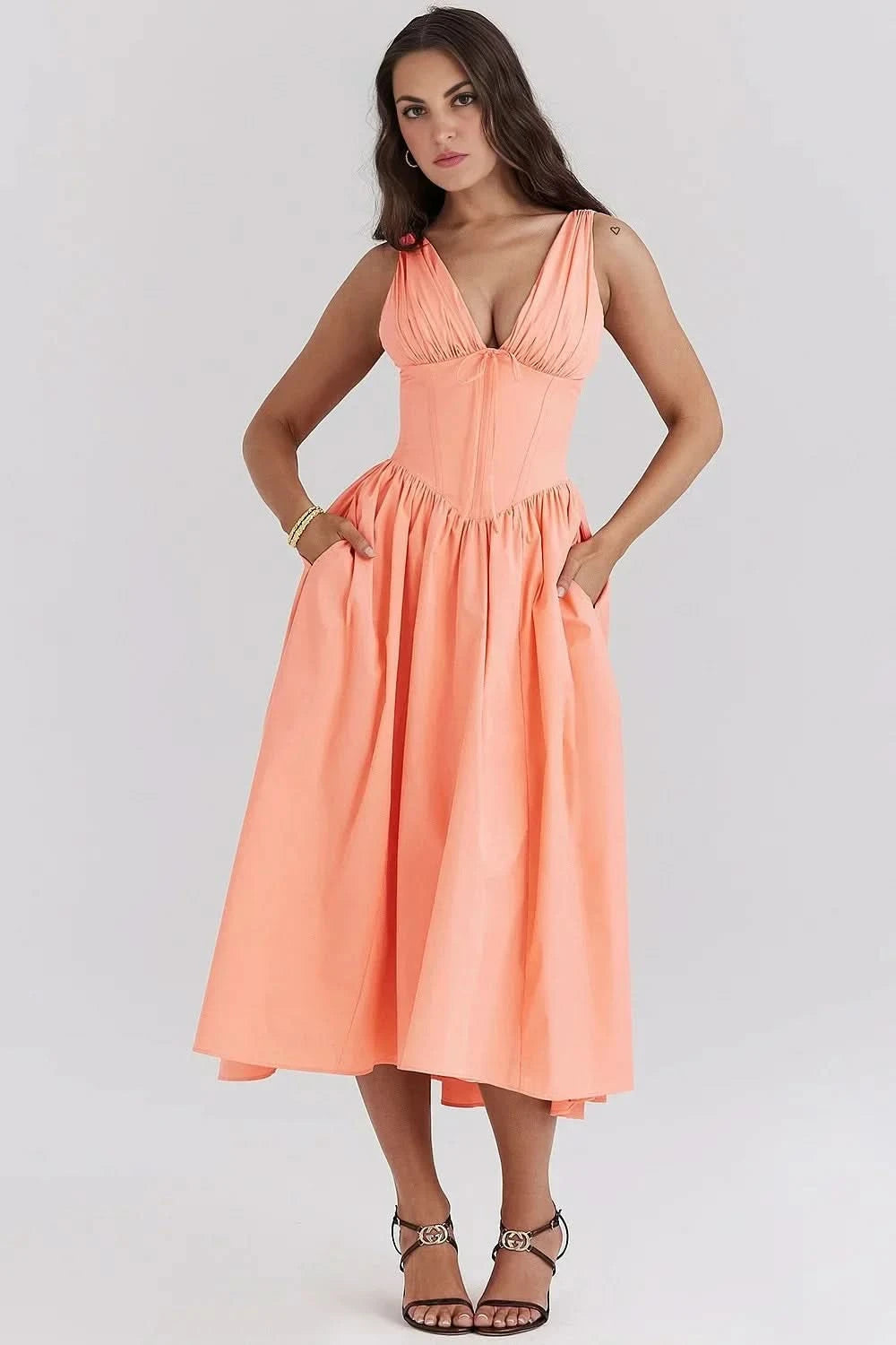 Coral sleeveless corset sundress midi with V-neck and flowing skirt