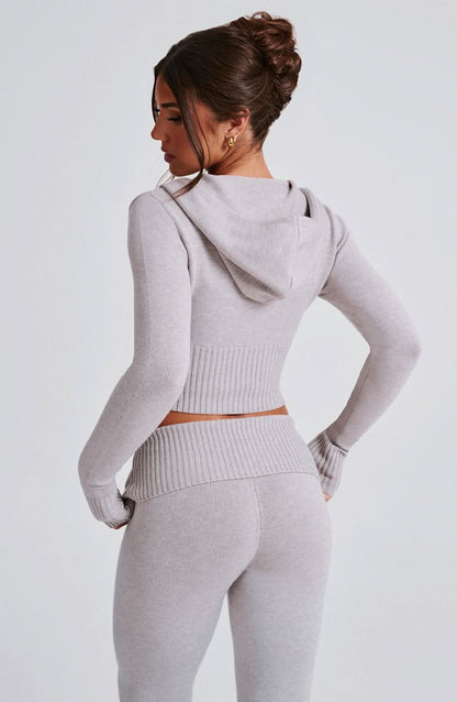 Back view of gray ribbed knit crop hoodie and matching leggings set