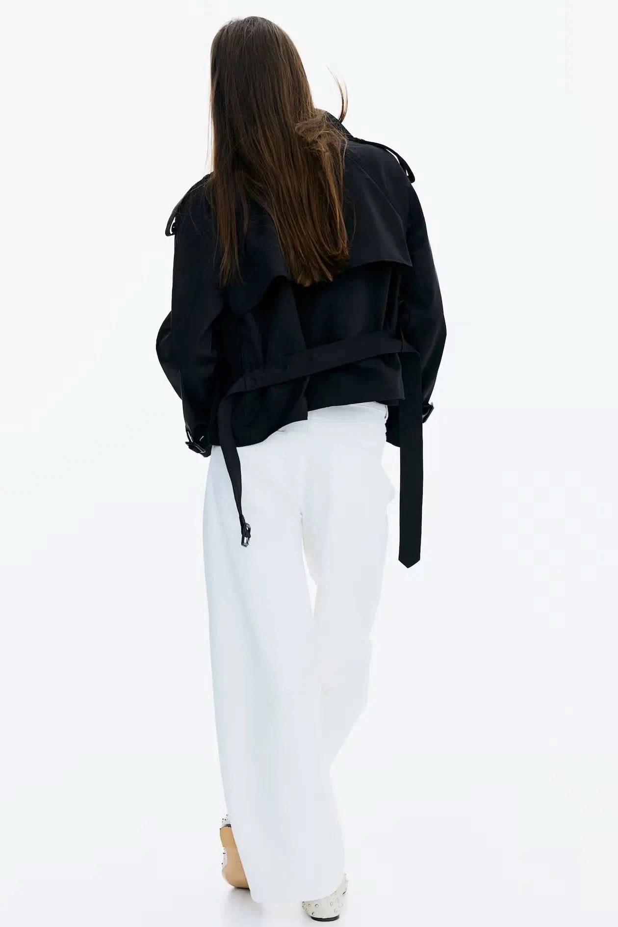 Black short trench coat back view with tie belt and relaxed fit