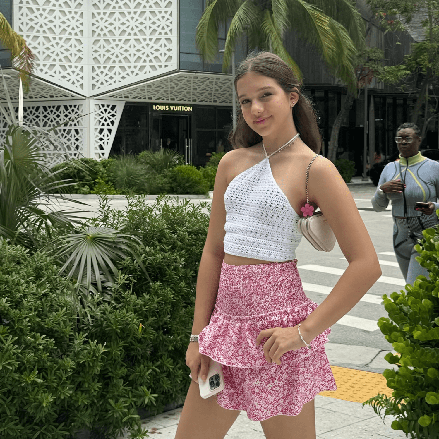 Pink patterned mini skirt with tiered ruffle hem and smocked waistband