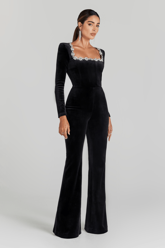 Black velvet jumpsuit with long sleeves and crystal-embellished square neckline