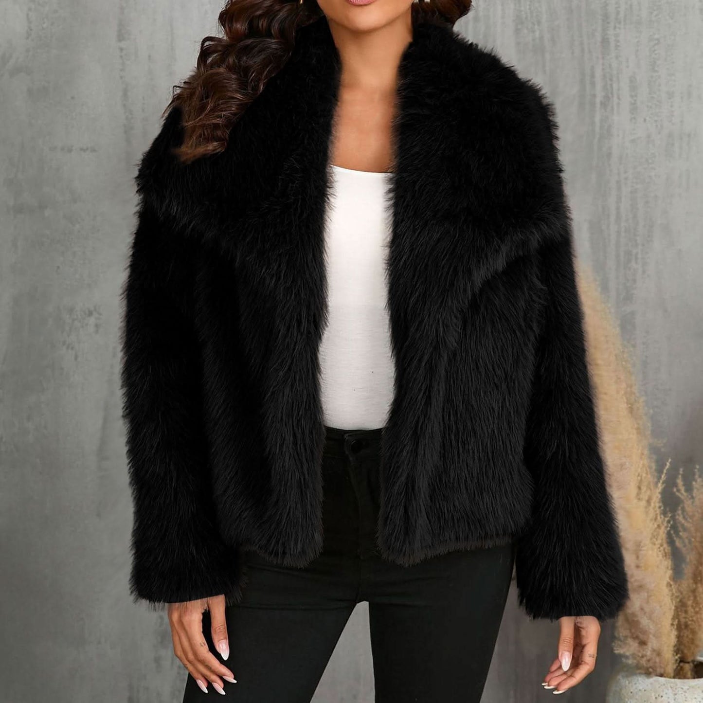 Black faux fur jacket with notch lapels and cropped length