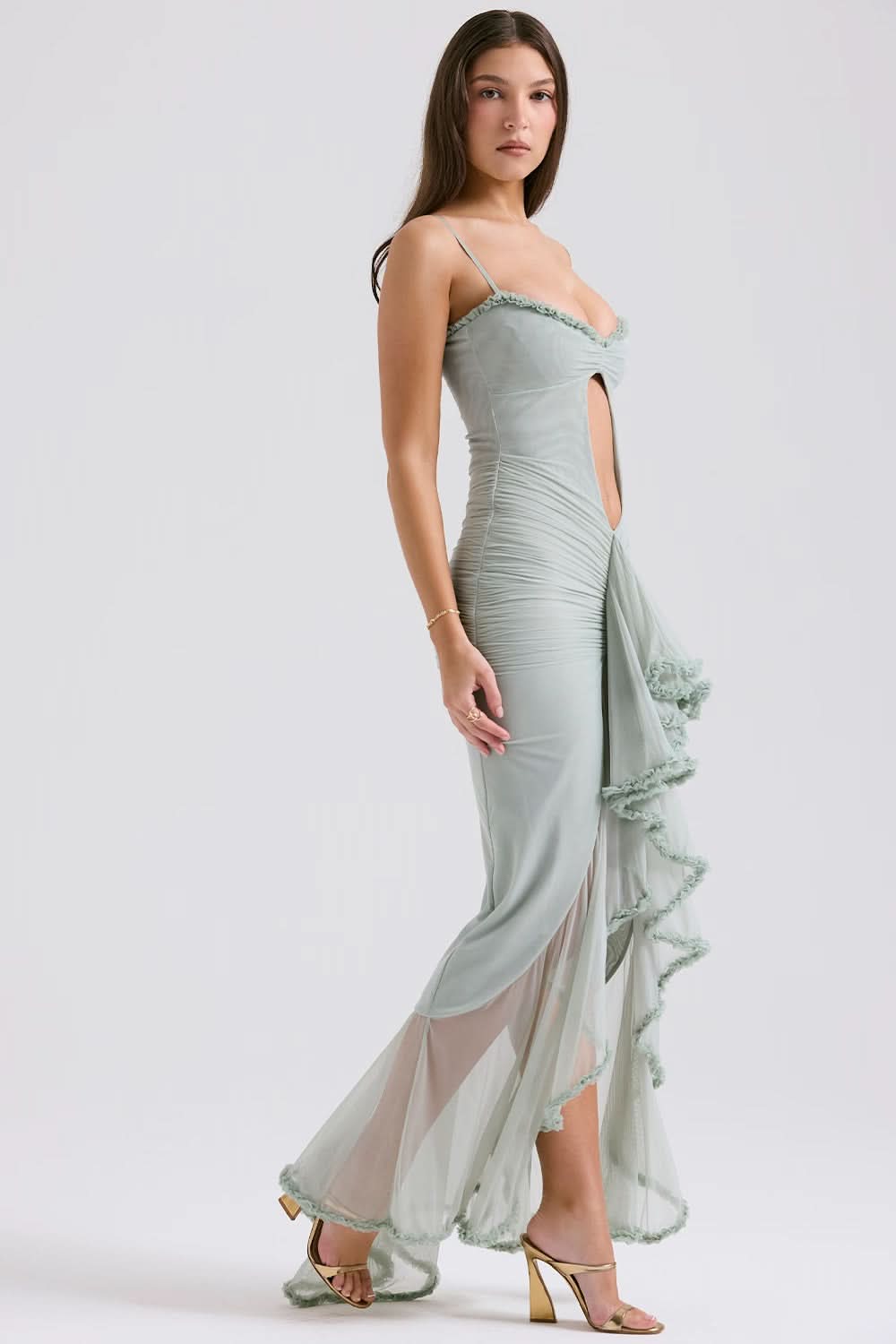 Sage green maxi dress side view showing keyhole detail and flowing ruffled skirt