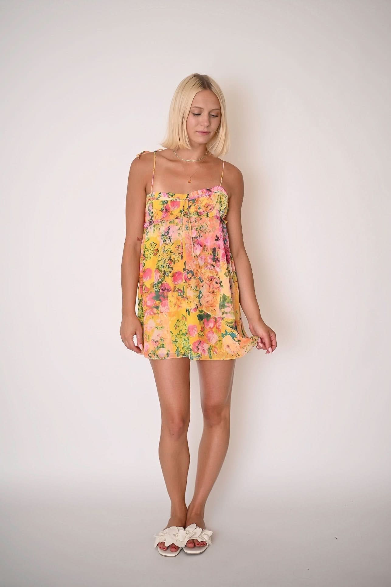 Yellow floral mini dress with pink and orange roses, spaghetti straps, front view