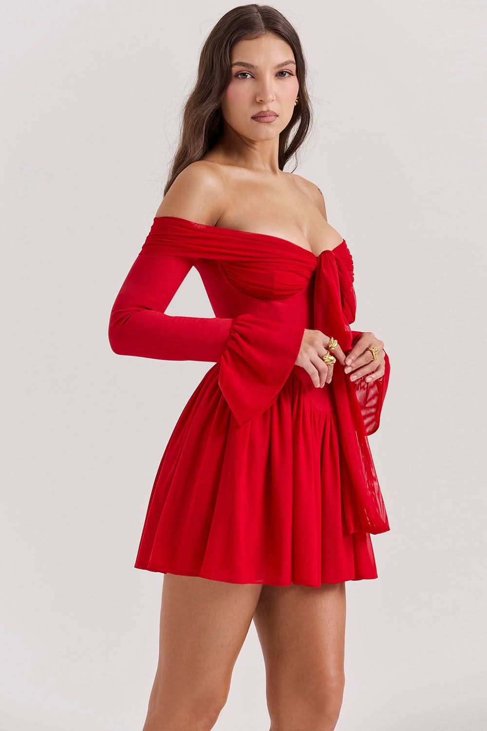 Red off-shoulder mini dress with long sleeves and tie-front detail with full skirt