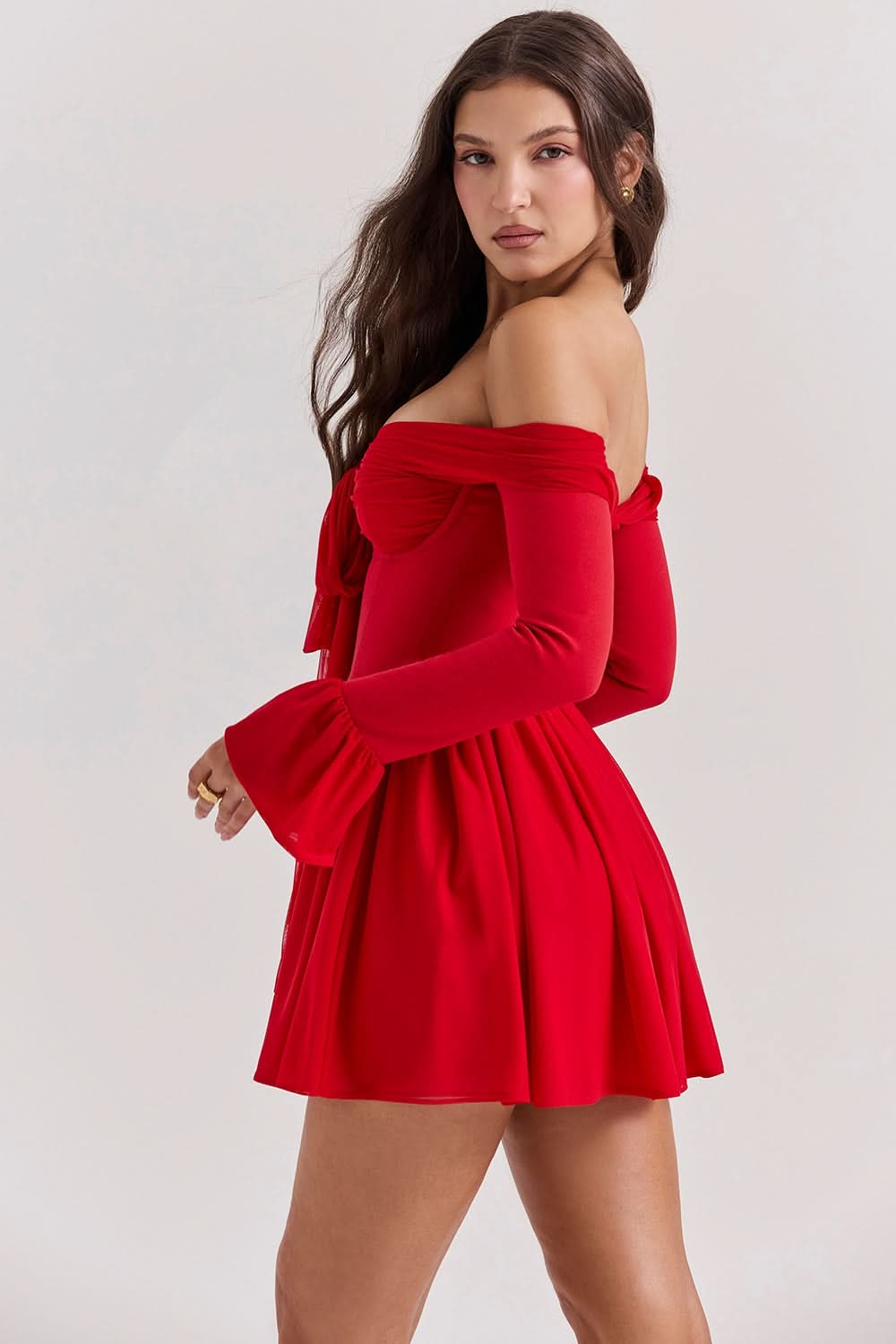 Red mini dress back view showing off-shoulder design and flared bell sleeves