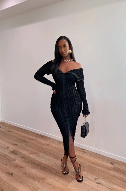 Black off-shoulder textured midi dress with long sleeves and front slit