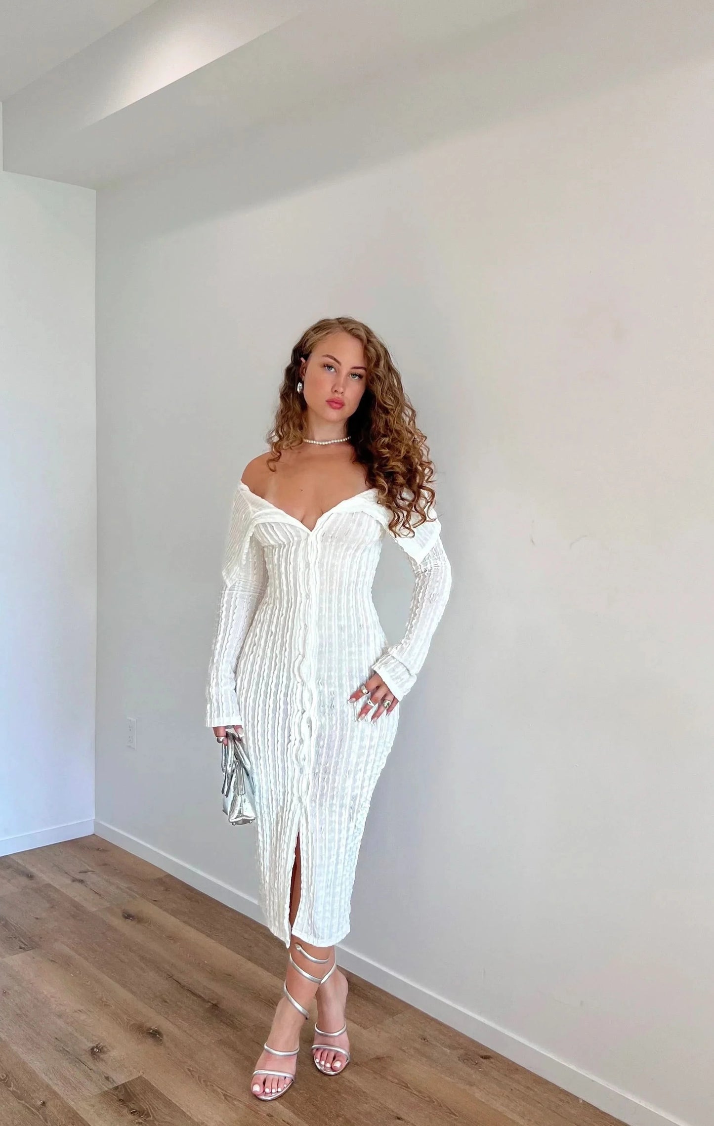 White off-shoulder ribbed midi dress with long sleeves and front slit