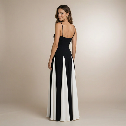 Back view of black sweetheart maxi dress with open back and pleated white panel detail