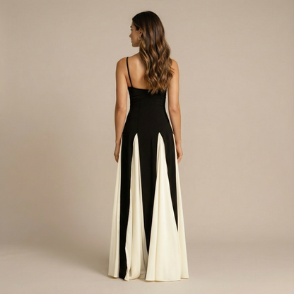 Side view of colorblock maxi dress showing A-line pleated skirt flowing to ankles for women