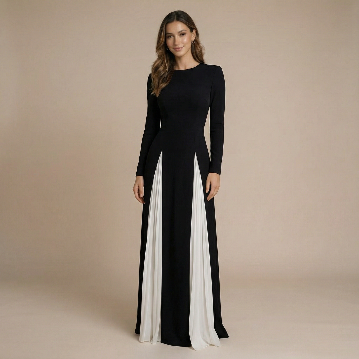 Black maxi dress with long sleeves and crew neckline featuring white pleated panels