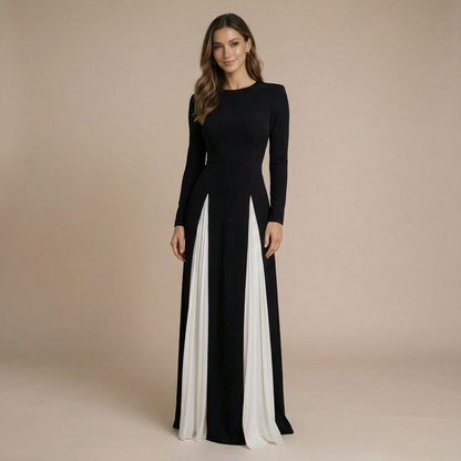 Black maxi dress with long sleeves and crew neckline featuring white pleated panels