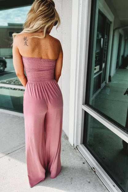 Mauve pink strapless jumpsuit back view with smocked bodice