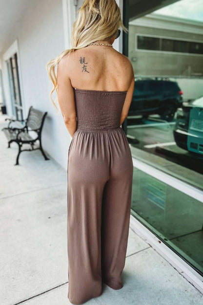 Taupe strapless jumpsuit back view with open back detail