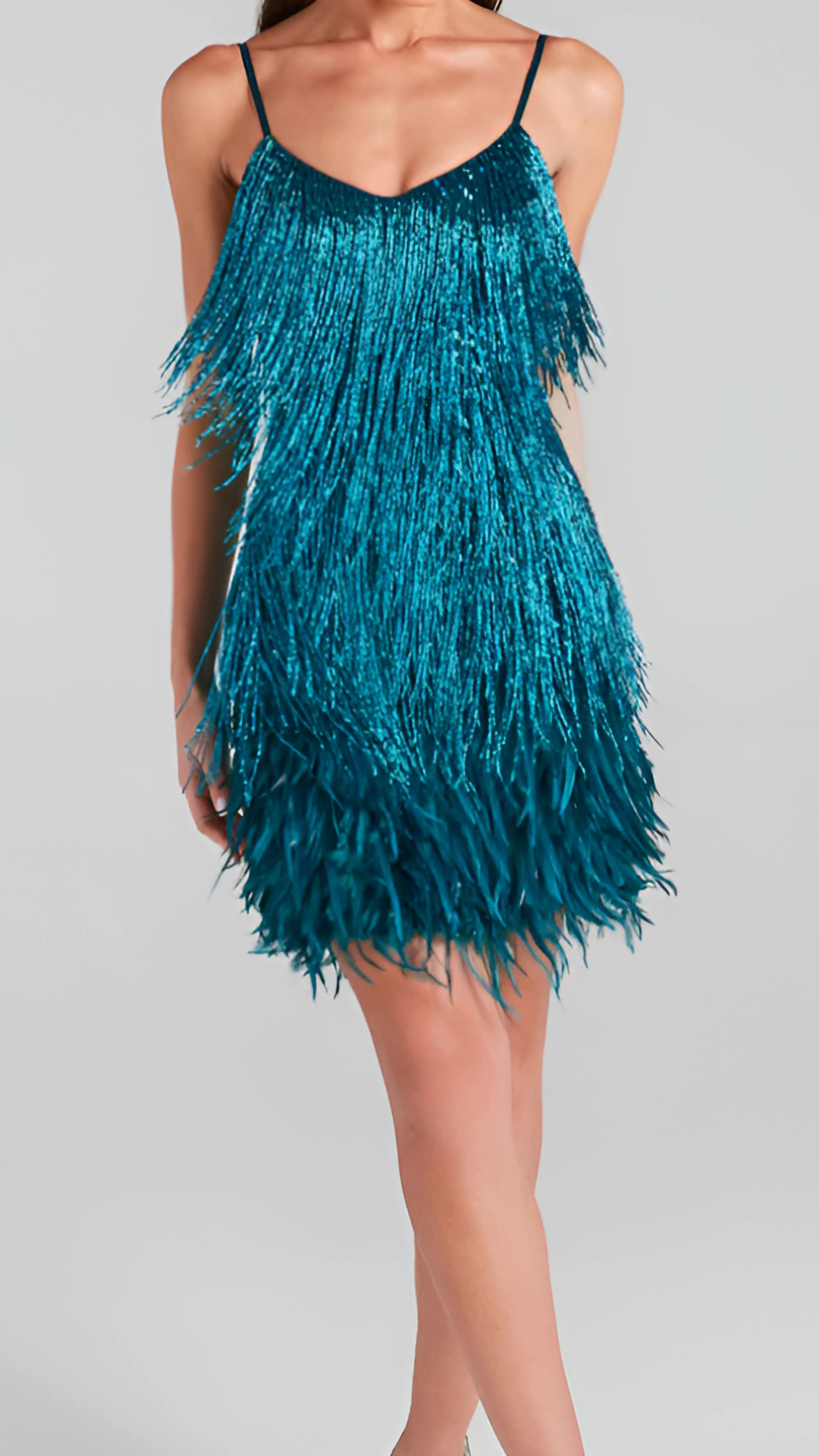 Teal fringed mini dress back view showing layered fringe and spaghetti straps