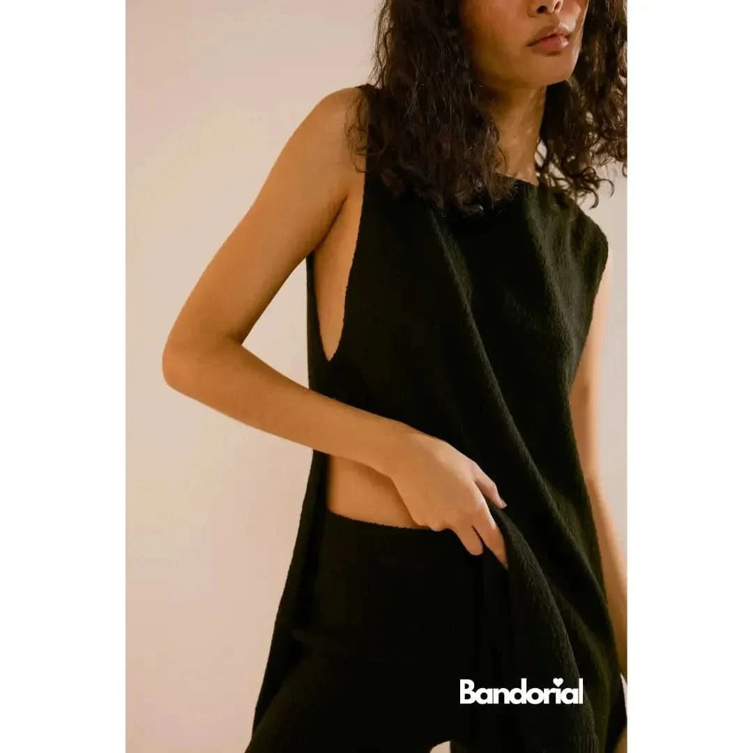 Olive green textured sleeveless dress with deep V-neckline detail