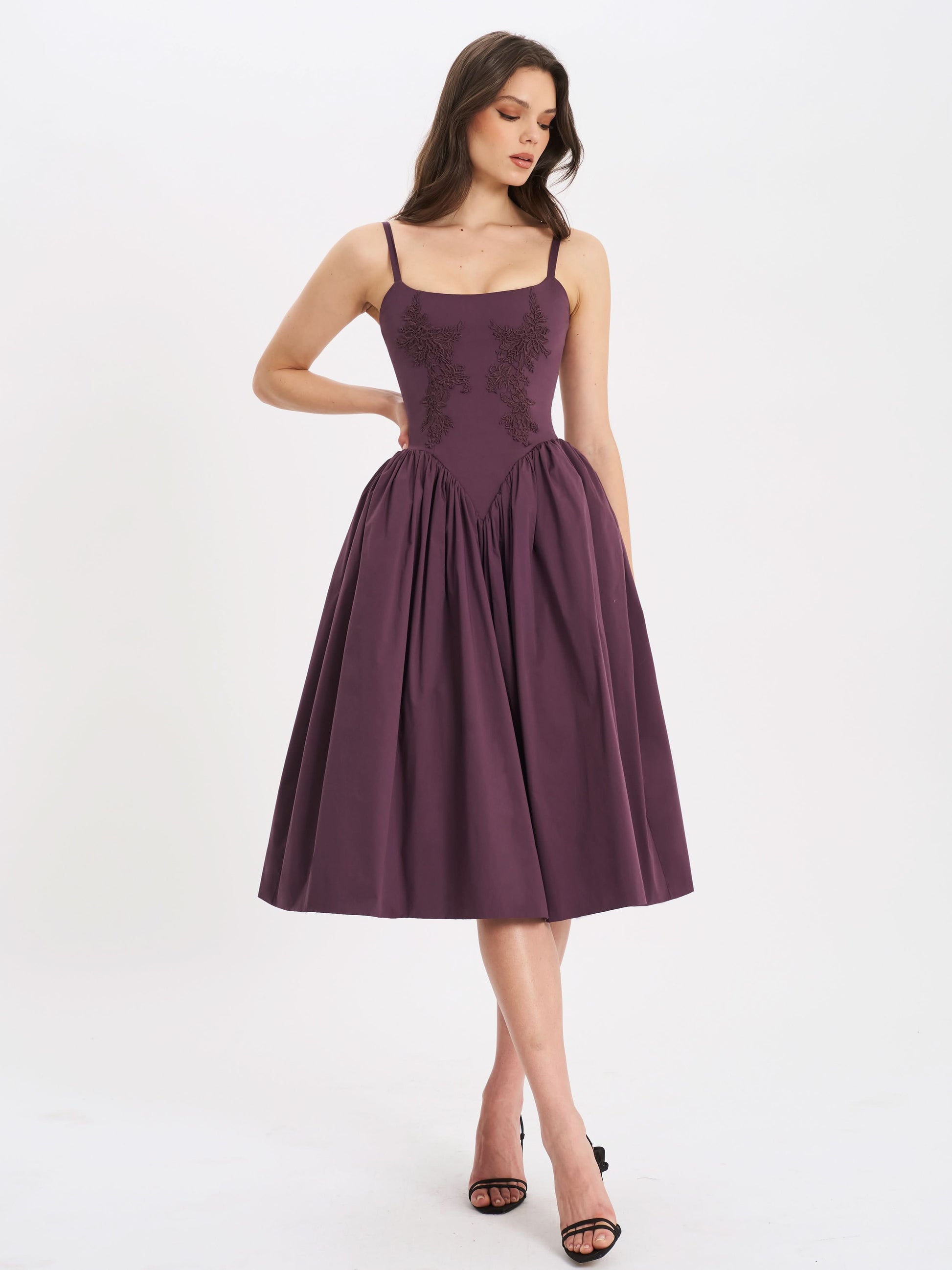 Purple lace-embroidered midi dress with square neckline and pleated skirt on model
