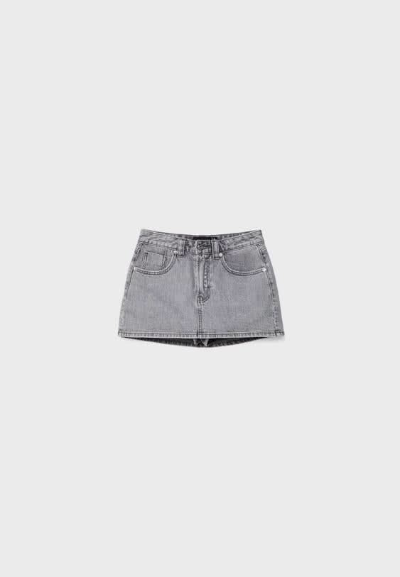 Light gray denim skort flat lay showing front view with contrasting hem detail