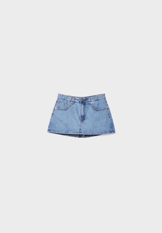 Light blue denim skort flat lay showing full front view and silhouette
