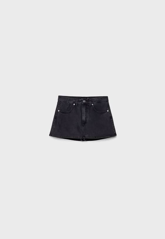 Black denim skort flat lay showing front pockets and waistband closure