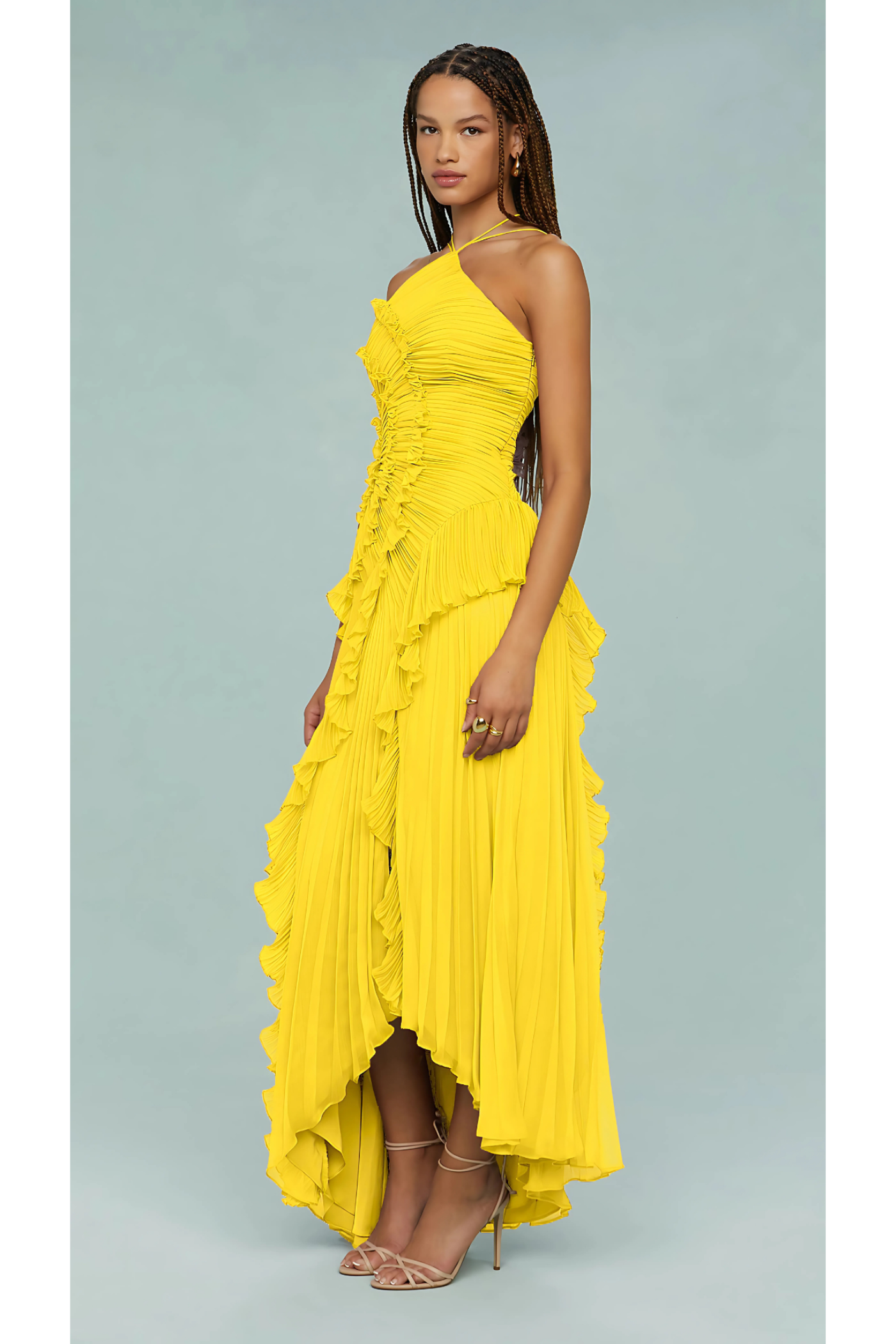 Side view of yellow halter maxi dress with dramatic layered ruffles
