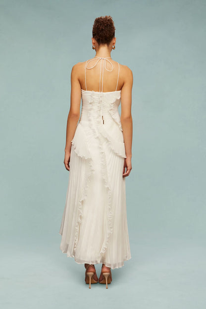 Back view of cream halter maxi dress with tie closure and ruffles