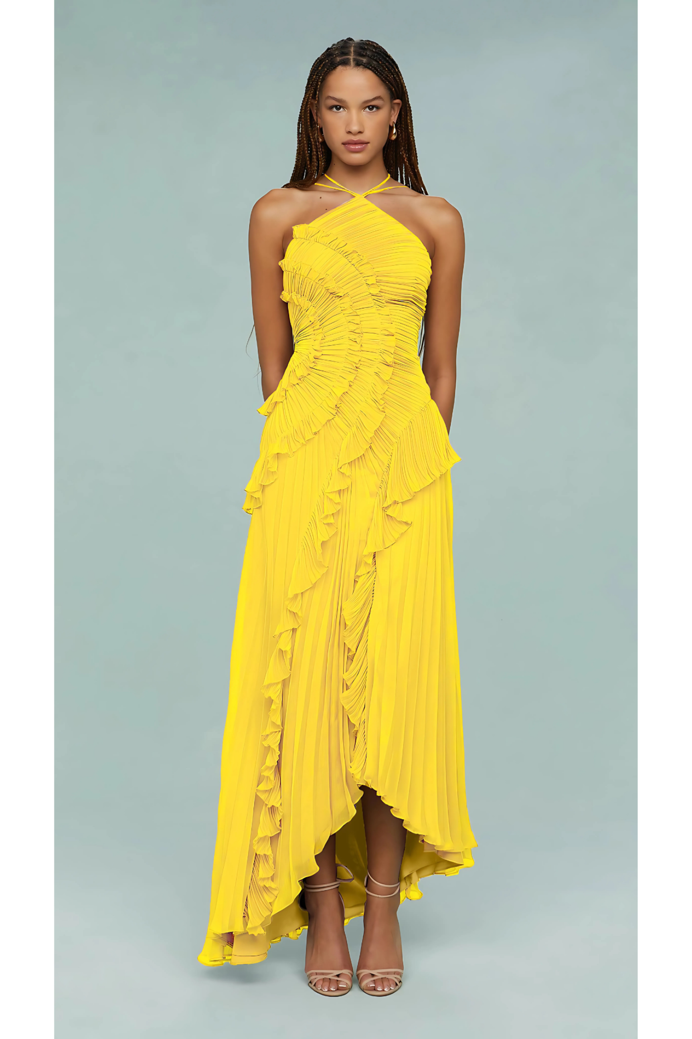 Full-length yellow halter dress showing cascading ruffle details