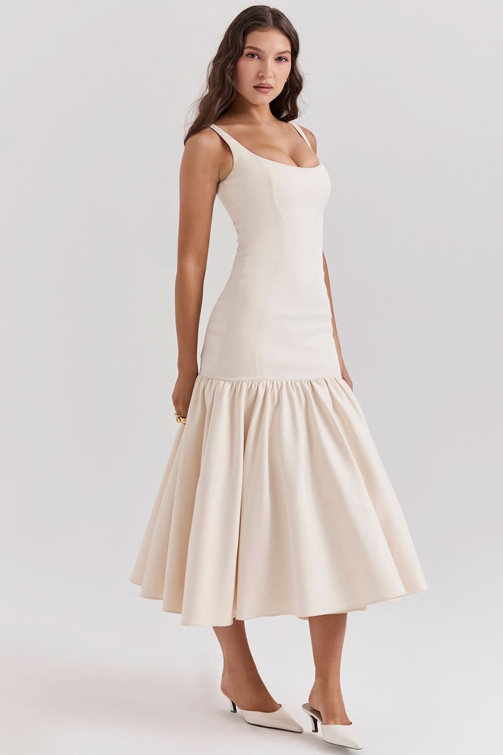 Cream sleeveless waist midi dress with flared skirt, side view