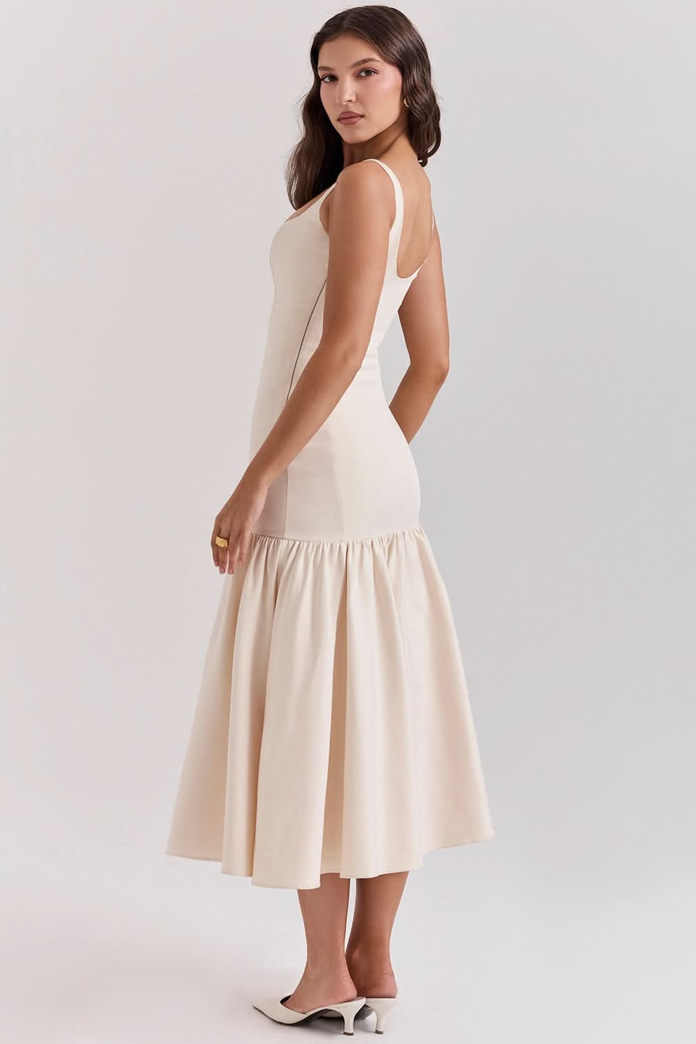 Back view of cream waist midi dress with open back detail