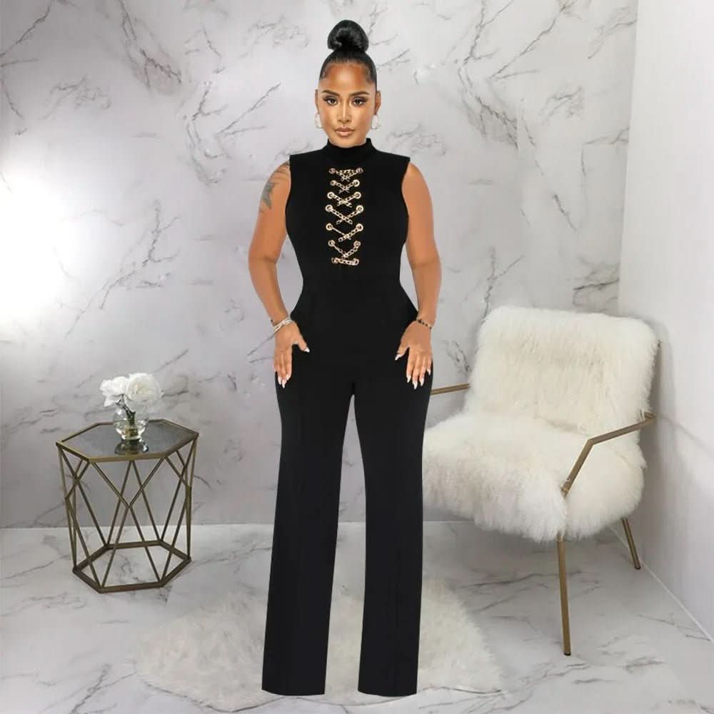 Black sleeveless jumpsuit with gold chain lace-up front detail and wide legs
