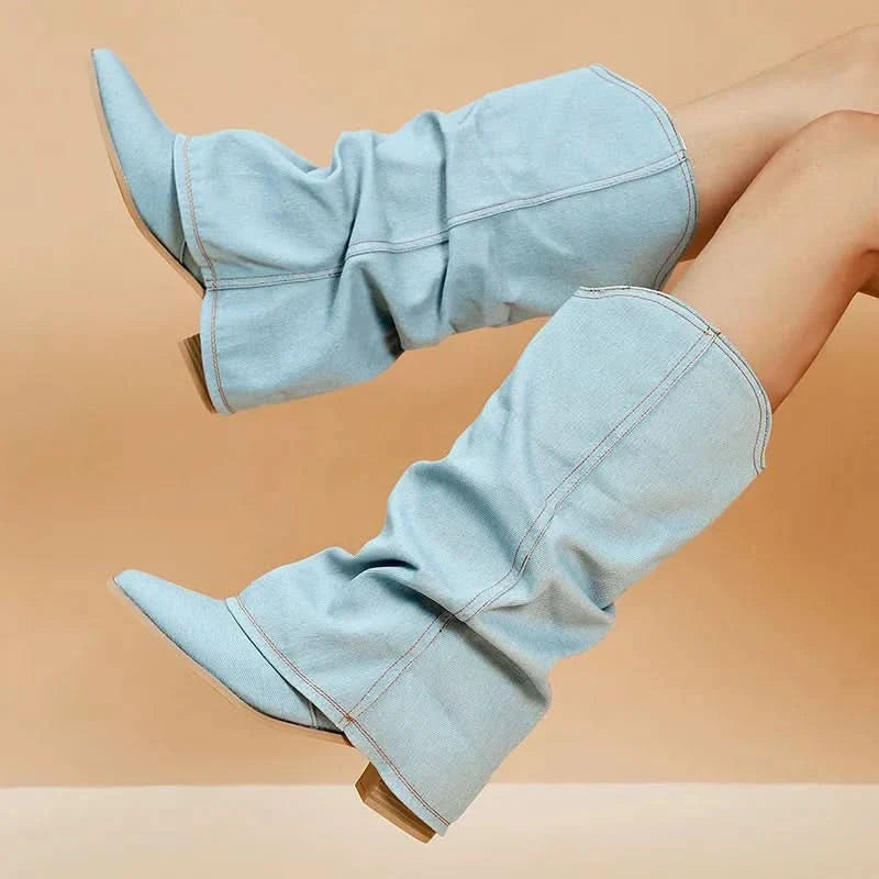 Front profile of women's light blue denim boots with slouchy shaft and block heel