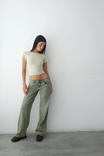 Sage green low-rise jeans with wide-leg cut and worn-in finish