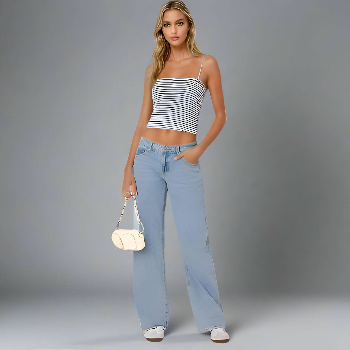Light blue low-rise jeans with white and navy striped crop tank top