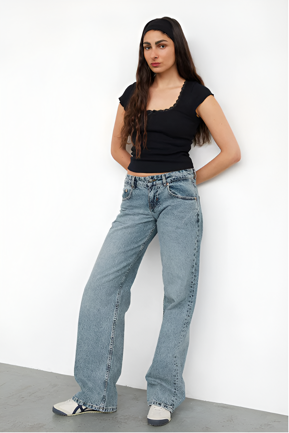 Light wash low-rise jeans with black ribbed square-neck crop top