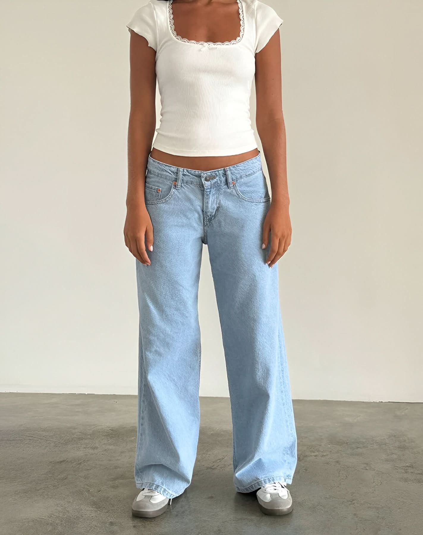 Light blue low-rise jeans with white ribbed square-neck crop top