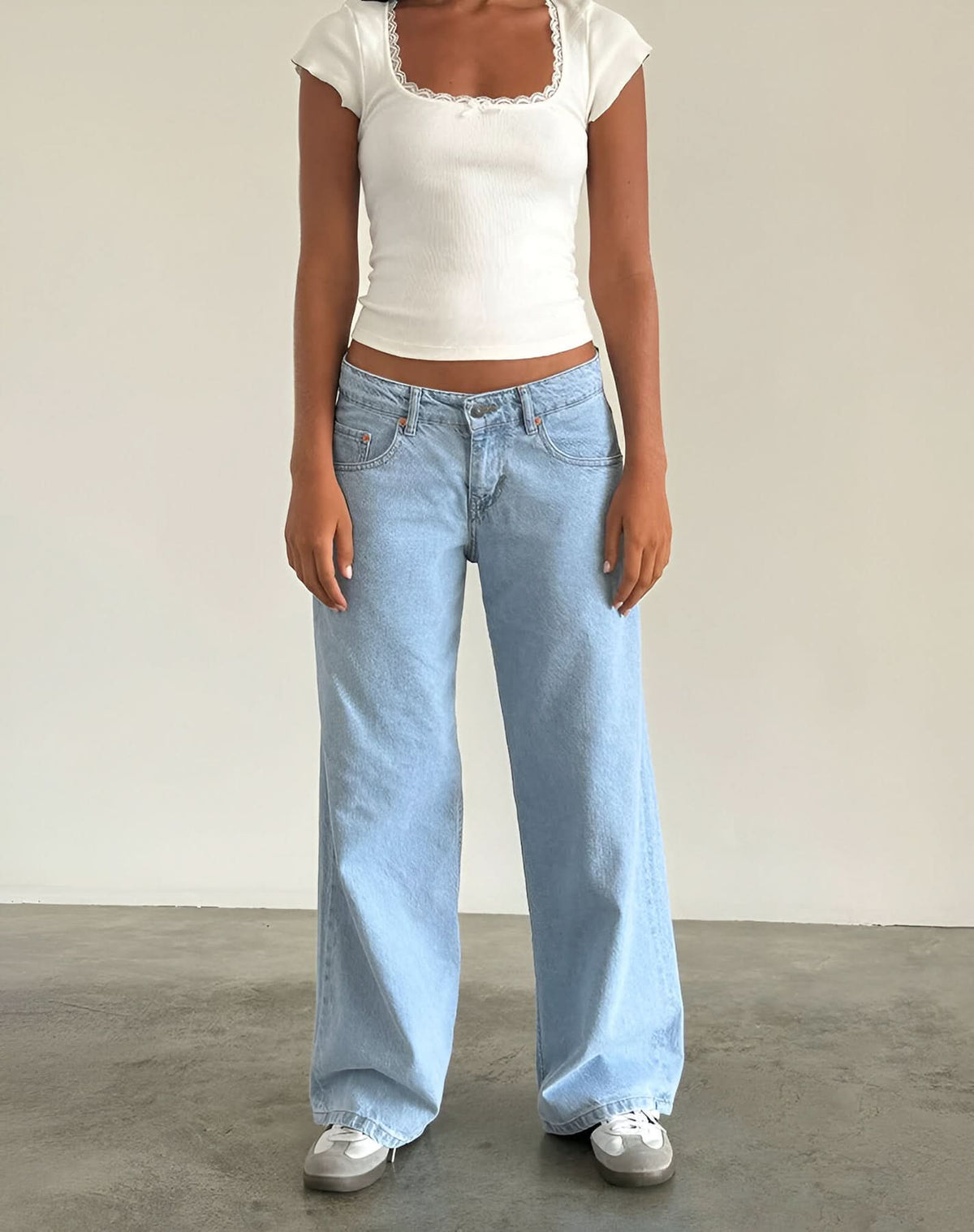Light blue low-rise jeans with white ribbed square-neck crop top