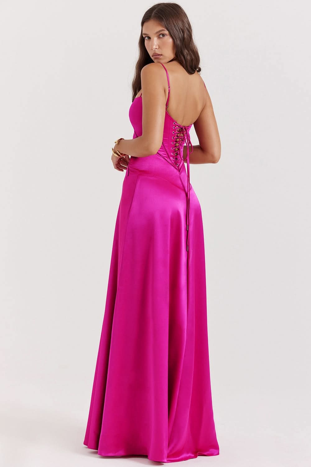 Magenta lace-up maxi dress with open back and flowing skirt