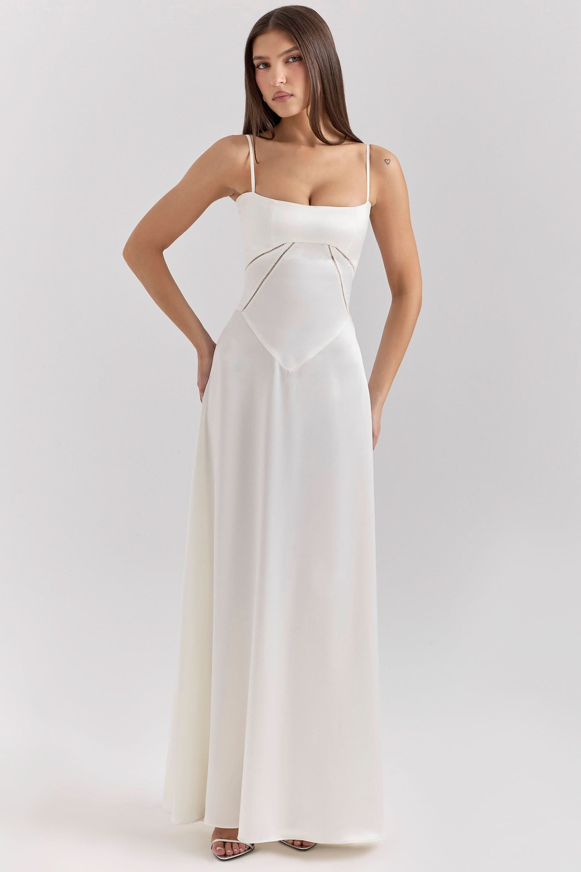 Cream maxi dress with lace-up back detail and flowing silhouette