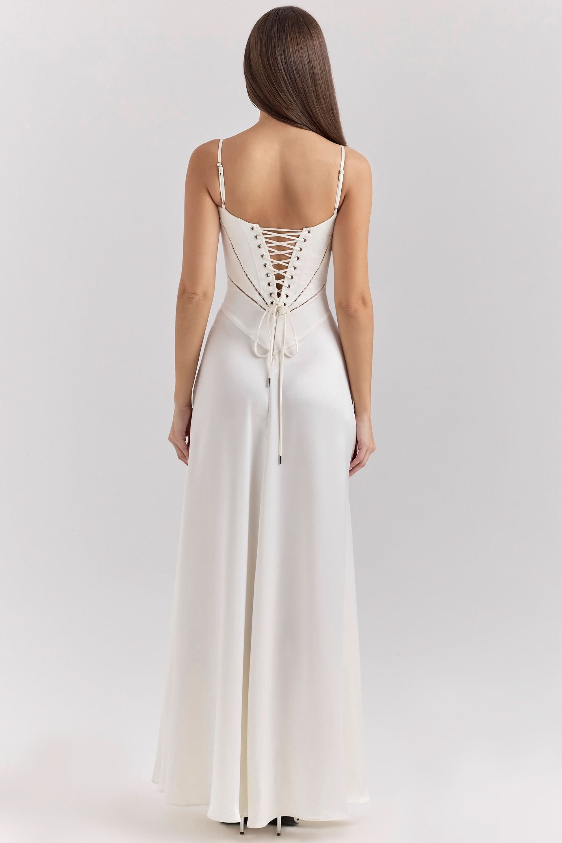 Back view of cream maxi dress showing lace-up corset closure