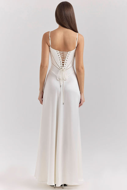Back view of cream maxi dress showing lace-up corset closure