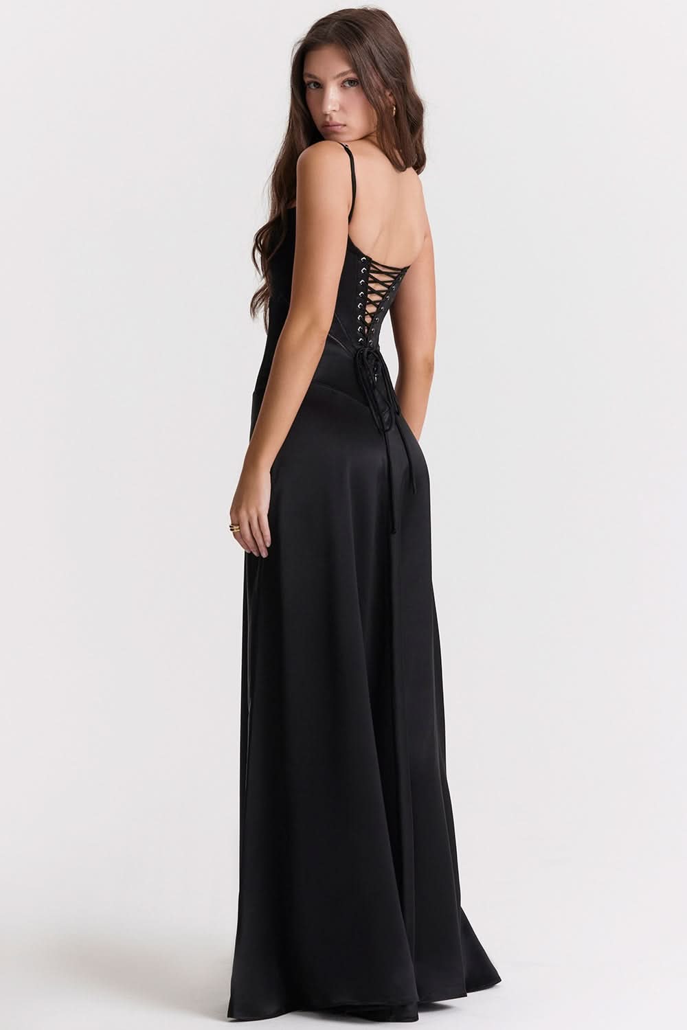 Back view of black maxi dress with lace-up corset back closure