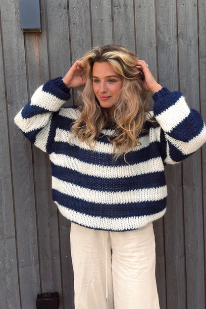 Navy and cream horizontal stripe knit pullover with cream pants